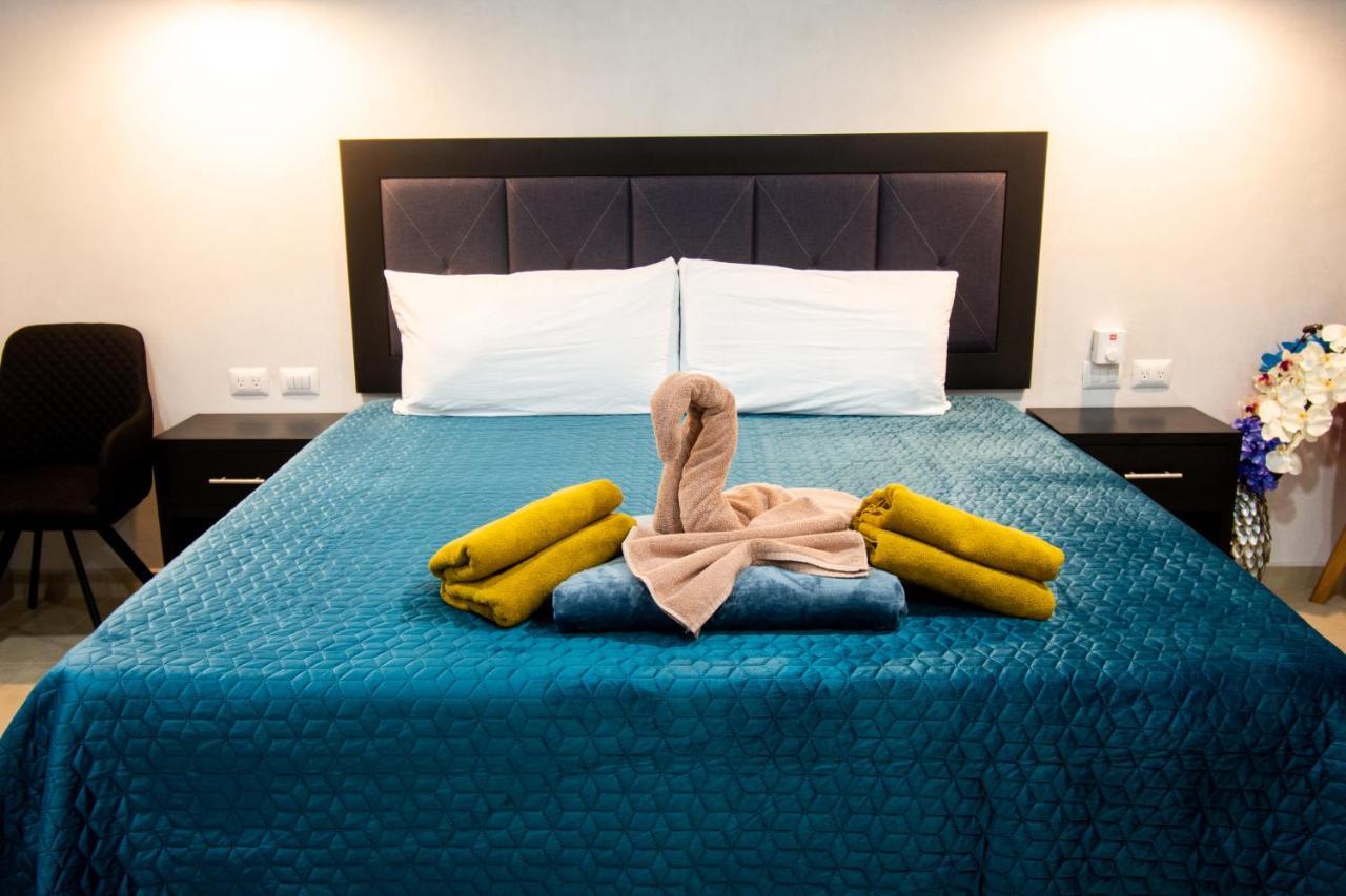 Hotel Casa Tortuga Tulum - Cenotes Park Inclusive Exterior foto A bed with a towel swan